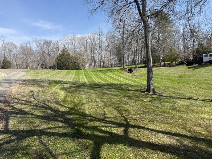 Manicured lawn with mowing stripes by Alcazar Lawncare Services